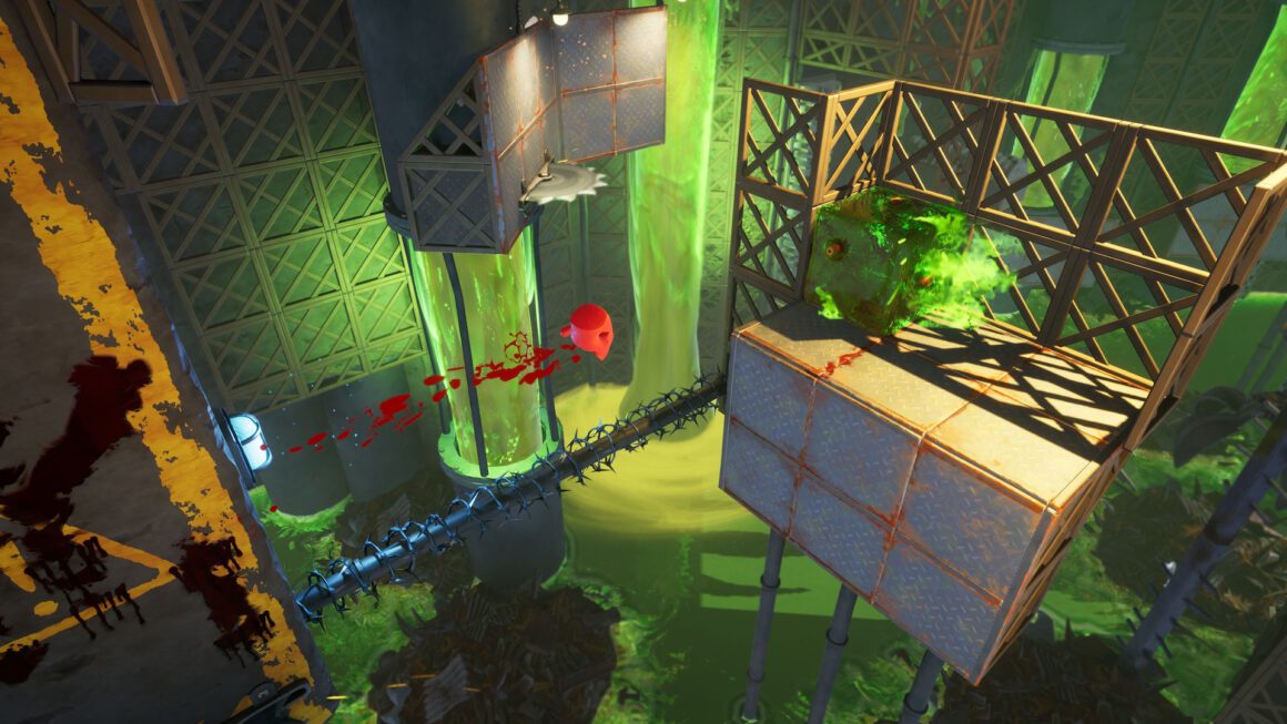 Super Meat Boy spring zu einer Plattform in einer Fabrikumgebung